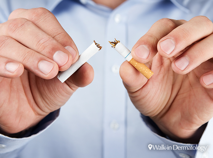 Man snapping a cigarette in half