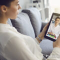 A patient having a virtual appointment with her dermatologist